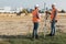 road construction workers using measuring device on the field