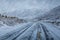 Road cover with snow in a snow blizzard and fog