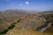 A road crosses the rocky desert of the atlas mountains in Morocco