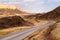 Road and curve in sandstone desert landscape, Israel