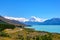 The road curves along Lake Pukaki and Mount Cook on a clear day at Peter`s Lookout
