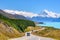 The road curves along Lake Pukaki and Mount Cook on a clear day at Peter`s Lookout