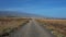 Road cutting through the arid volcanic lanscape of Tenerife island, Canary Islands, Spain