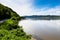 Road by the Danube river, forests and mountains