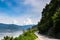 Road by the Danube river, forests and mountains