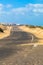 Road through desert dunes near famara. Lanzarote Spain