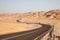 Road through the desert in Liwa Oasis