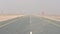 Road in desert during sand storm