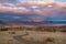 Road dirt mountains sunset clouds sky