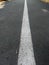 Road with a dividing strip, an original photo, gray texture