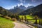 Road in Dolomites with the St. John& x27;s in Ranui Chapel, Santa Maddalena. Italy