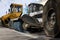 Road equipment stands against the backdrop of the city, close-up