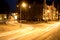 Road in Erfurt at night with car lights and lantern
