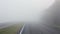 Road with fog in the morning. Misty highway.