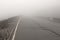 Road in the Fog. Thick Fog and Empty Road. Mystic Foggy Road. Pl