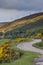 Road following North Sea coast near Westgarty Burn, Scotland.