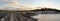 Road and footpath over Jindabyne Dam wall with mountain background