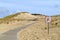 Road with forbidden area in dunes