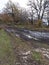 A road in the forest on a mountain plateau, autumn mud and mud.