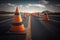 road with fresh asphalt layer and traffic cones to direct drivers to slow down