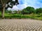 Road in front of house, paving block, green view