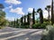 Road in a garden with a blue sky in BacalhÃ´a Buddha Eden