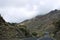 Road between the gorges on the track to the Teide volcano in Tenerife with a car window, natural background