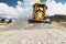 Road grader at the construction site. Powerful construction machine for ground leveling and excavation. Close-up. Professional