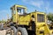 Road grader - heavy earth moving road construction equipment