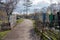 Road among the graves at the old Troitsk cemetery 1842 in the city of Krasnoyarsk, in the spring.