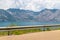 Road with guard railing, beautiful view over a lake