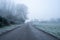 A road heading into the distance. On an atmospheric frosty winters day. Castlemorton Common. UK