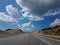 road highway street clouds blue sky