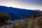 The road on hill and fence on mountain background