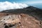 The road and jeep truck above clouds on Mountain Etna volcano in Sicily, Italy. The biggest active volcano in Europe