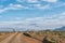 Road landscape, with cattle grid gate, in the Tankwa Karoo