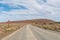 Road landscape with warning sign in the Tankwa Karoo