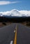 A road leading in the direction of the Ngauruhoe / Mt. Doom covered in snow in the clouds in the North Island in New Zealand