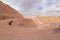 Road leading down to the deep blue Hidden Lake near the Timna park,surrounded by mountains near Eilat city, Arava Valley,