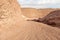 Road leading down to the deep blue Hidden Lake near the Timna park,surrounded by mountains near Eilat city, Arava Valley,