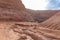 Road leading down to the deep blue Hidden Lake near the Timna park,surrounded by mountains near Eilat city, Arava Valley,