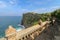 The road leading to the Uluwatu temple. Bali coast near Uluwatu temple, Bali island, Indonesia. Scenic coastal landscape of high