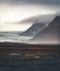 Road leading towards huge glacier and mountains in Iceland Vatnajokull glacier aerial drone image with street highway