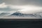 Road leading towards huge glacier and mountains in Iceland Vatnajokull glacier aerial drone image with street highway