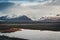 Road leading towards huge glacier and mountains in Iceland Vatnajokull glacier aerial drone image with street highway