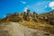 The road leads to the fabulous mushroom rocks. Beautiful landscape with unusual mountains. Fairy Chimneys, Pasabag, Monks Valley,