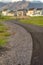 Road that leads to lovely multi storey homes with mountain in the background