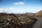 A Road leads through the volcanic lava fields of Timanfaya National Park in Lanzarote