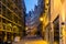 Road of a lighted city alley in antwerp city by night, Belgian architecture and street scenery, Antwerpen, Belgium, April 23, 2019