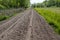 Road with loose sand and tire tracks